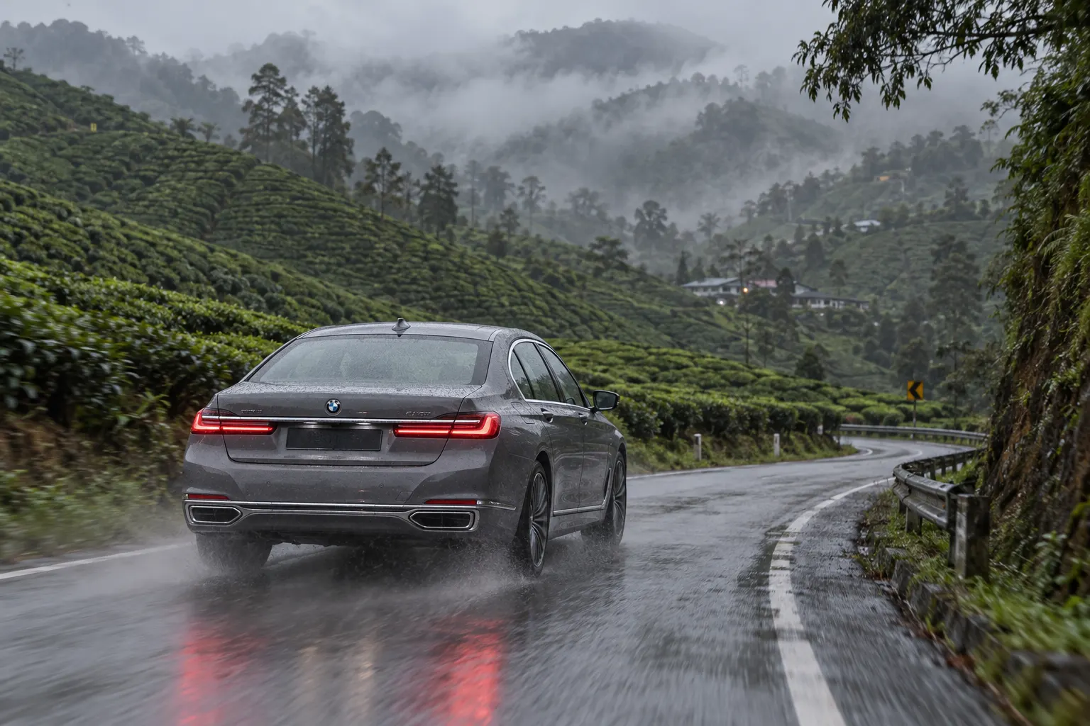 BMW 7 Series driving through misty Cameron Highlands tea plantations in November rain — malaysia in november