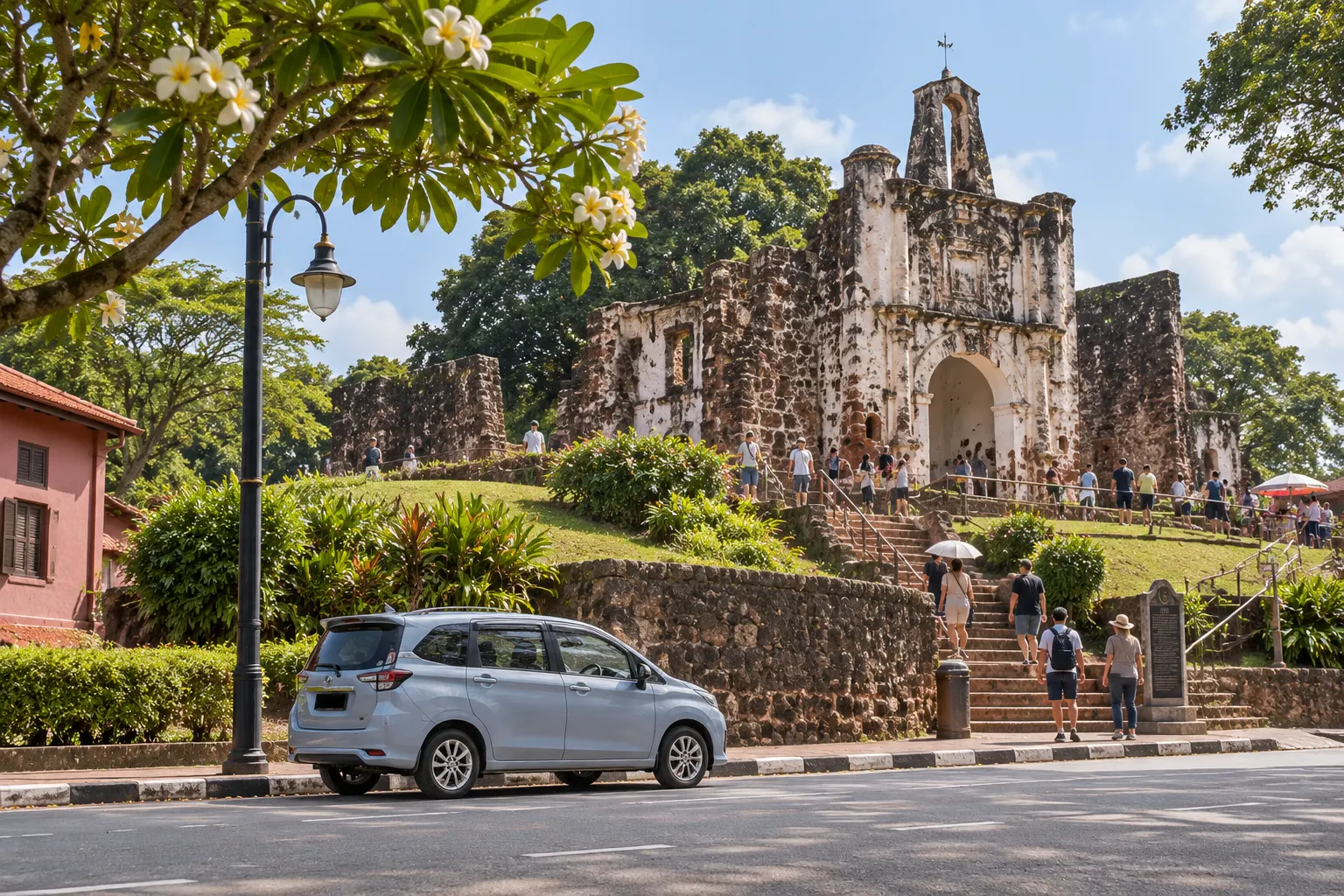 Historic fortress ruins in Melaka with a Perodua Alza parked on the road below — places to visit in melaka
